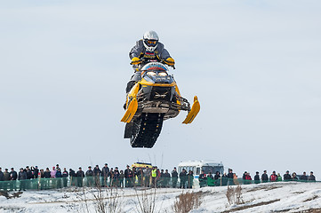 Image showing High jump of sportsman on snowmobile