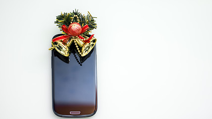 Image showing Smartphone and christmas bells 