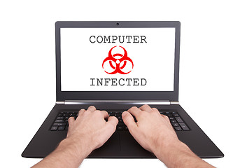 Image showing Man working on laptop, computer infected