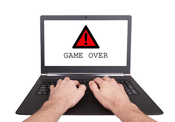 Image showing Man working on laptop, game over