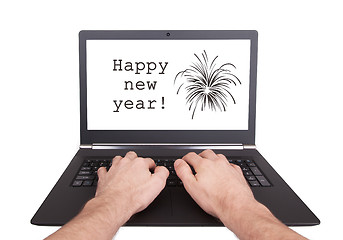 Image showing Man working on laptop, happy new year