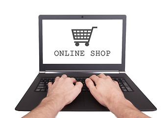 Image showing Man working on laptop, online shop