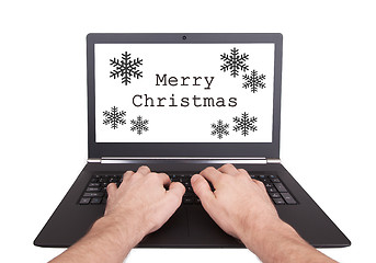 Image showing Man working on laptop, merry christmas
