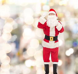 Image showing man in costume of santa claus with bag