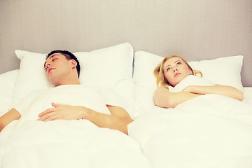 Image showing happy couple sleeping in bed