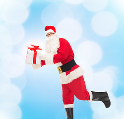 Image showing man in costume of santa claus with gift box