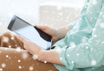 Image showing close up of man with tablet pc computer at home