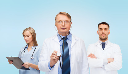 Image showing group of doctors with clipboard and stethoscopes