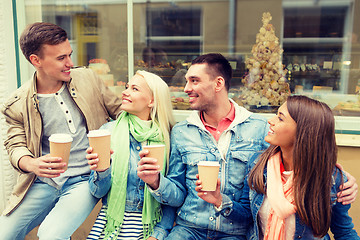 Image showing group of smiling friends with take away coffee