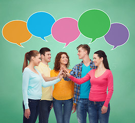 Image showing smiling teenagers making high five