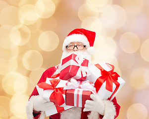 Image showing man in costume of santa claus with gift boxes