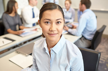 Image showing group of smiling businesspeople meeting in office