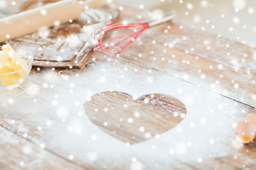 Image showing heart of flour on wooden table at home