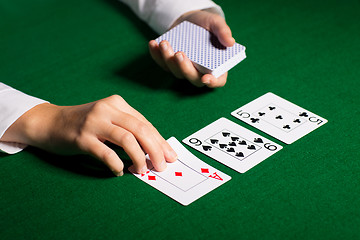 Image showing holdem dealer with playing cards