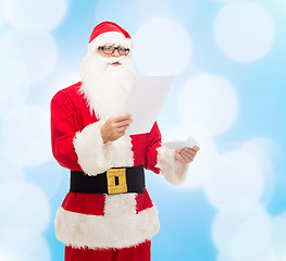 Image showing man in costume of santa claus with letter