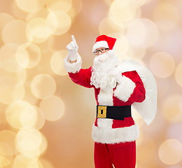 Image showing man in costume of santa claus with bag