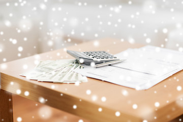 Image showing close up of money and calculator on table at home