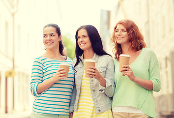 Image showing smiling teenage girls with on street