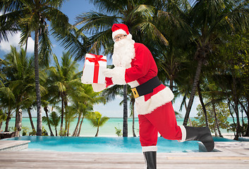 Image showing man in costume of santa claus with gift box