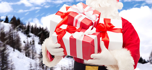 Image showing man in costume of santa claus with gift box