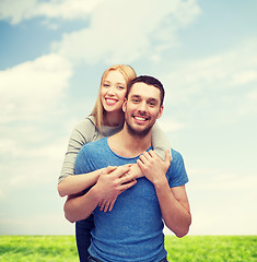 Image showing smiling couple hugging