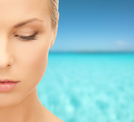 Image showing beautiful young woman over blue sky and sea