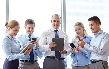 Image showing business people with tablet pc and smartphones