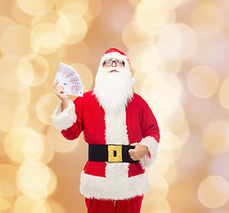 Image showing man in costume of santa claus with euro money