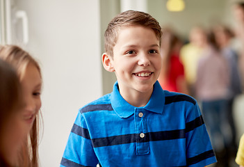 Image showing group of smiling school kids in corridor