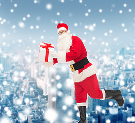 Image showing man in costume of santa claus with gift box