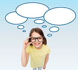 Image showing smiling girl in eyeglasses with blank text bubbles