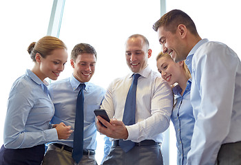 Image showing happy businesspeople with smartphone