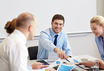 Image showing business people with papers meeting in office