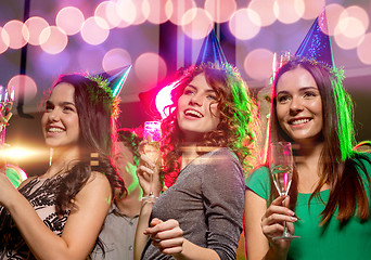 Image showing smiling friends with glasses of champagne in club