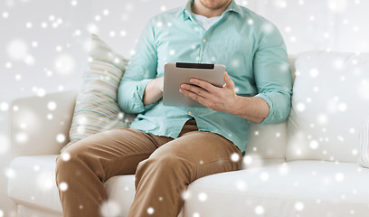 Image showing close up of man with tablet pc computer at home