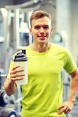 Image showing smiling man with protein shake bottle