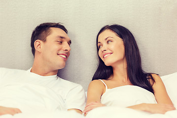 Image showing happy couple sleeping in bed