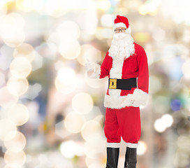 Image showing man in costume of santa claus showing thumbs up