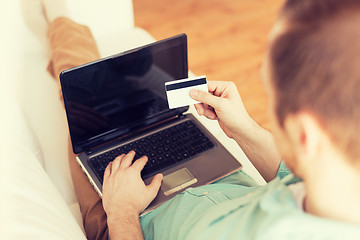 Image showing close up of man with laptop and credit card