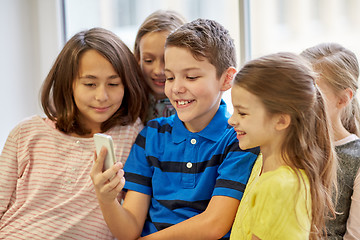 Image showing group of school kids taking selfie with smartphone