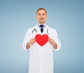 Image showing smiling male doctor with red heart and stethoscope