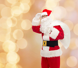 Image showing man in costume of santa claus with bag