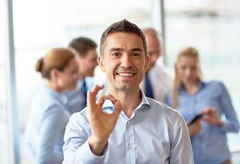 Image showing group of smiling businesspeople meeting in office