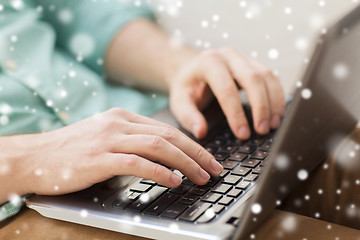 Image showing close up of man working with laptop at home