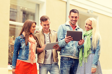 Image showing group of smiling friends with tablet pc computers