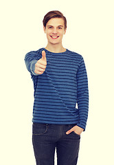 Image showing smiling teenage boy showing thumbs up