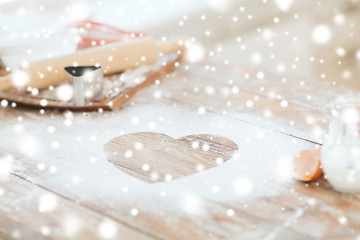 Image showing heart of flour on wooden table at home