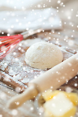 Image showing close up of dough and utensils on cutting board