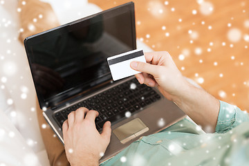 Image showing close up of man with laptop and credit card