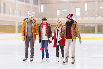 Image showing happy friends on skating rink